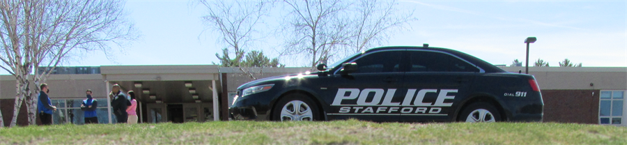 Officer Middleton's car parked in front of Stafford High School.
