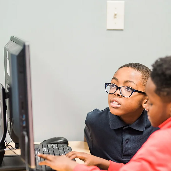 Kids looking at computer