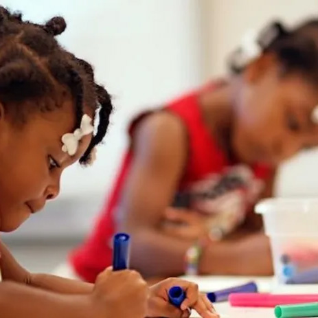 Girls coloring with markers