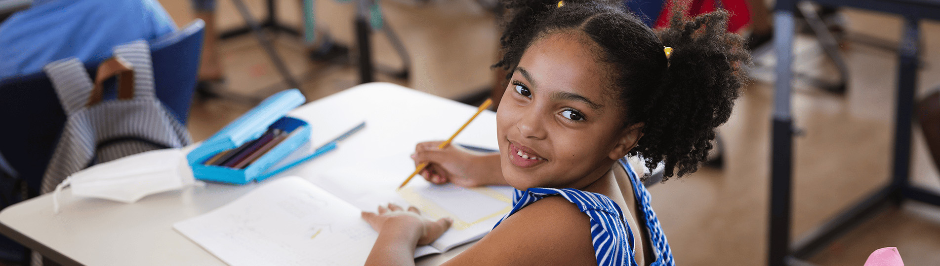 Girl doing classwork at desk