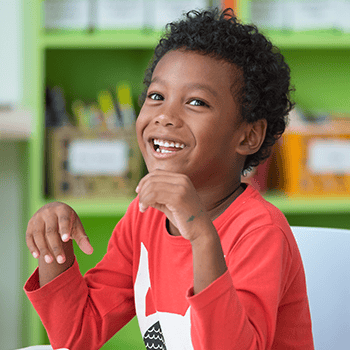 Boy smiling in classroom