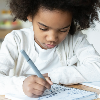 Girl doodling in notebook