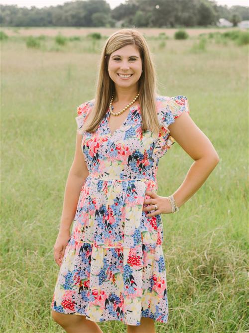 Photo of the Principal in a field 