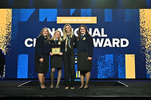 South Sumter FFA accepting National Chapter Award at 2023 Florida FFA State Convention