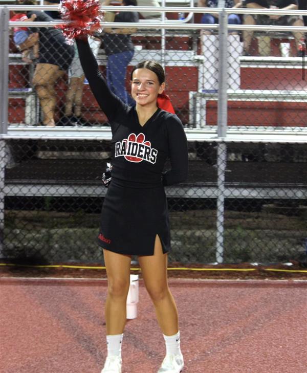 Cheerleader cheering at a football game