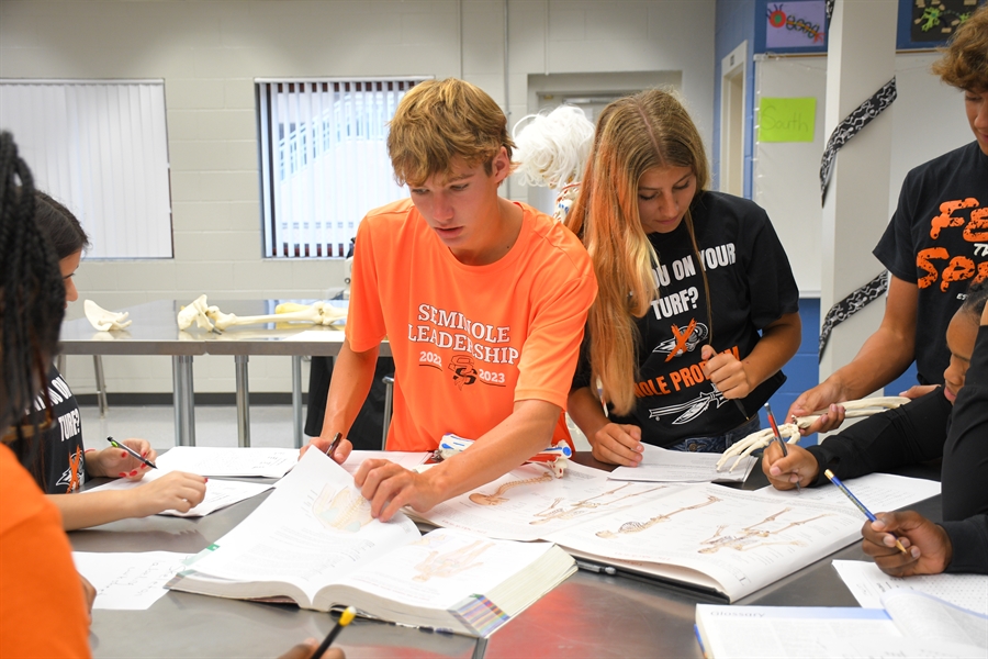 Two students in a science class working together on an assignment.