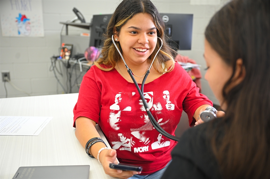 Students learning how to take vital signs