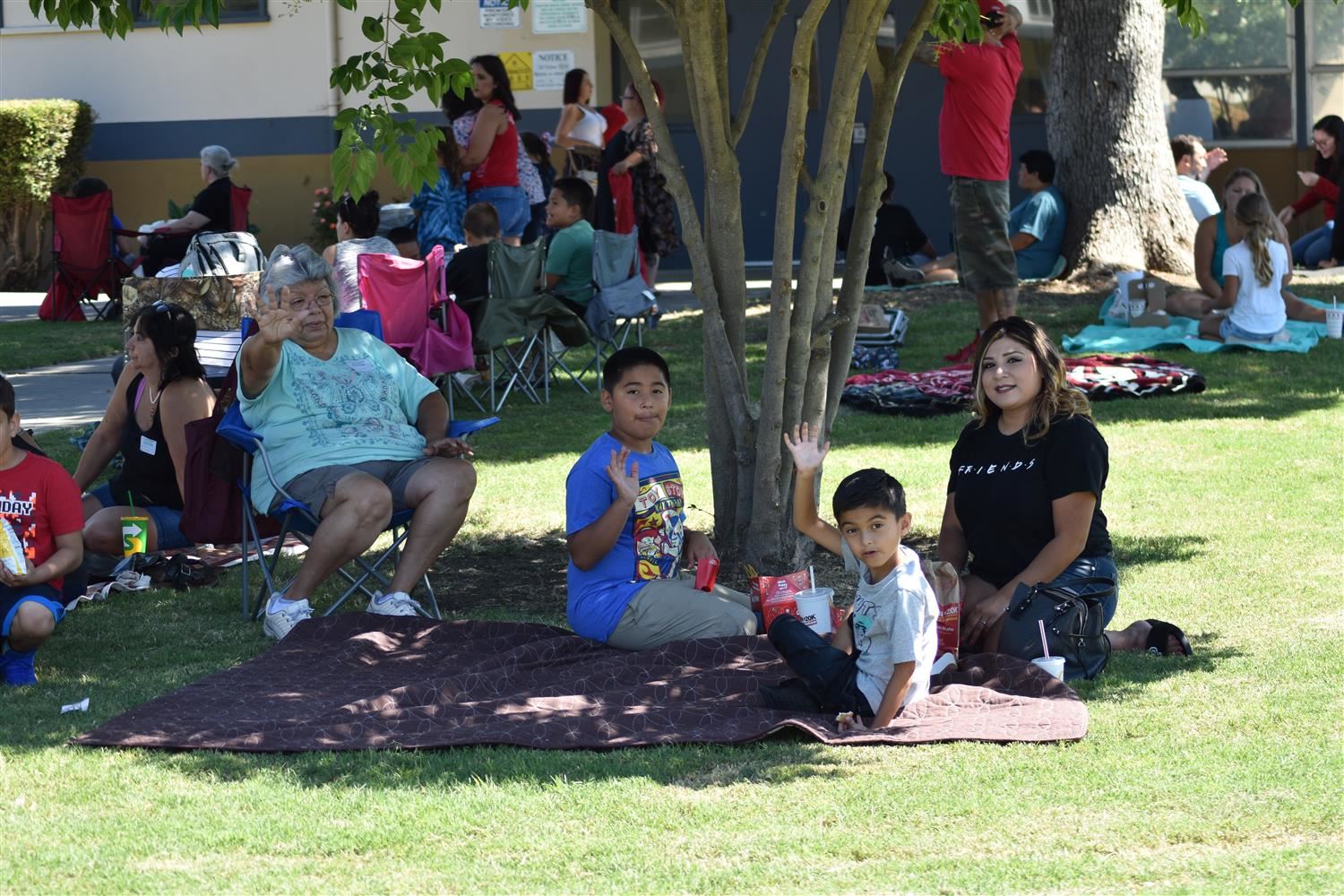 Family eating on the grass