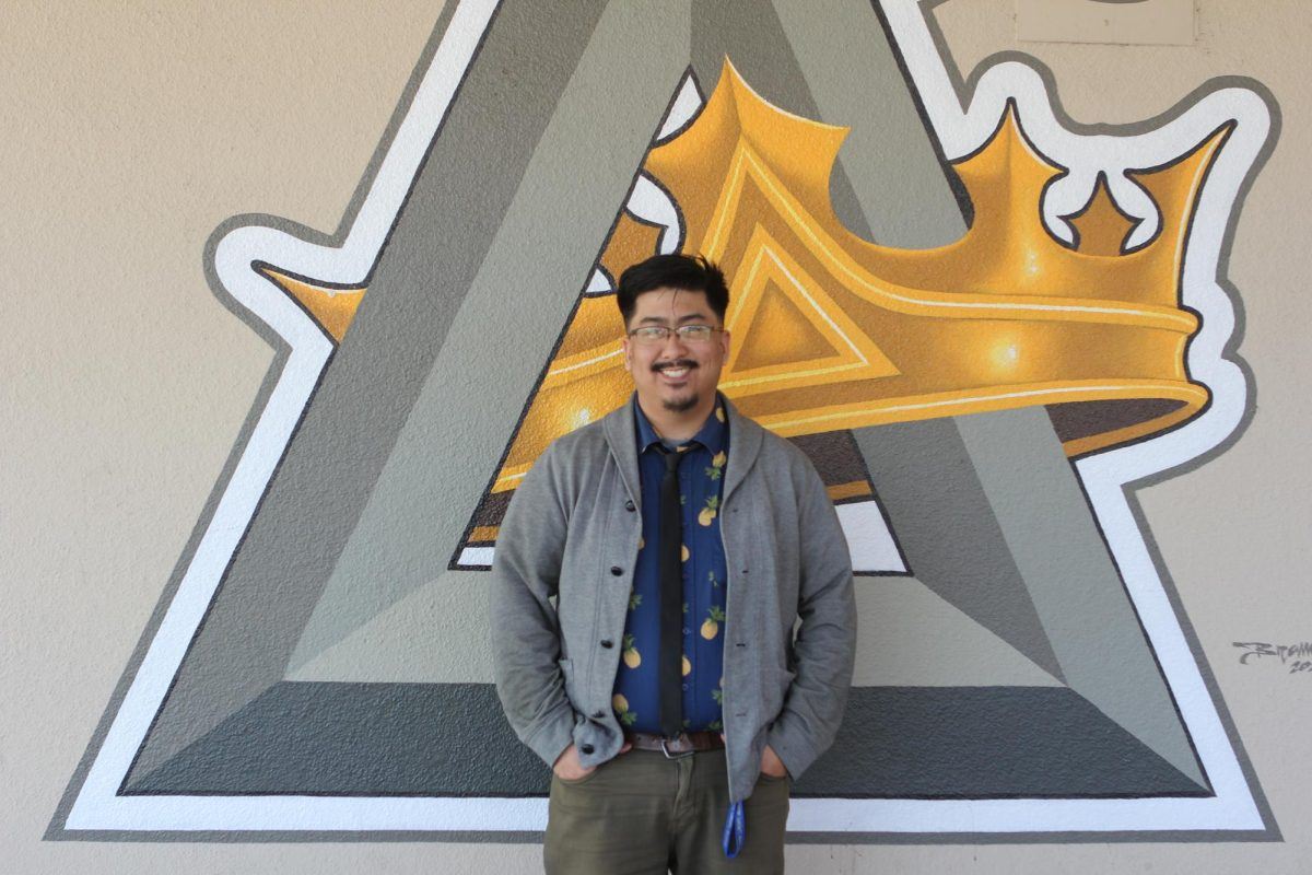 A stern but approving thumbs up.