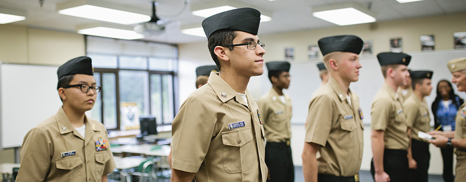 Students in NJROTC standing for inspection 