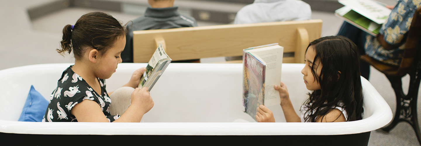 Students reading in bathtub in Chambers library