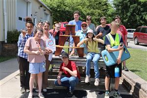 Vanguard students presenting Grace Fornicola's retirement gift