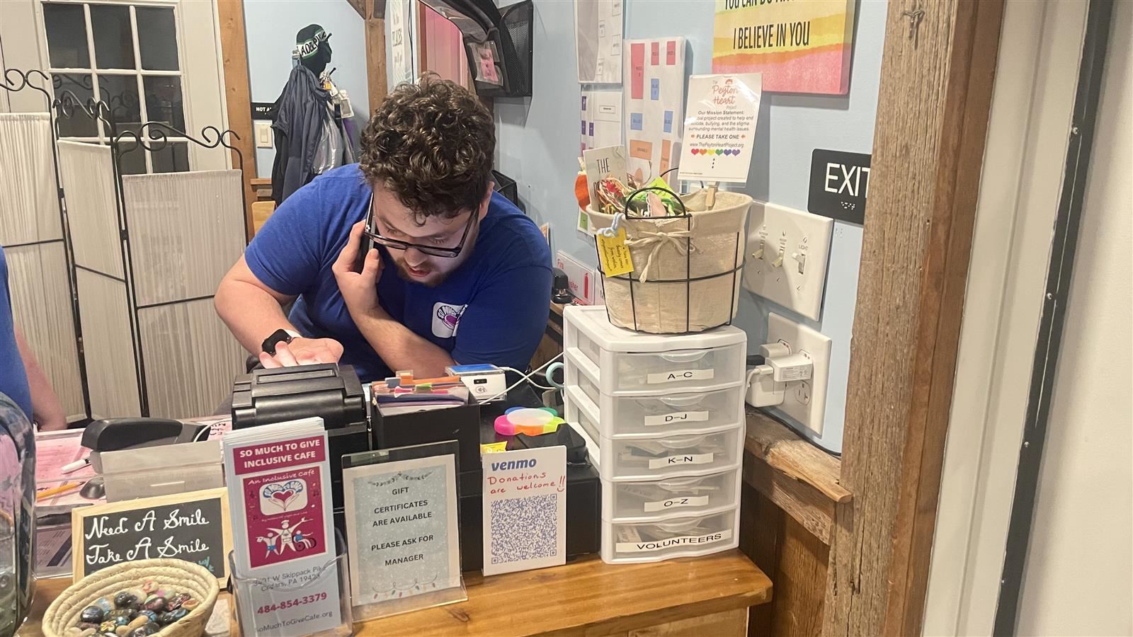 student at cash register
