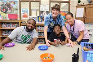 staff and student making crafts
