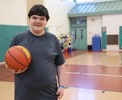  Student holding basketball