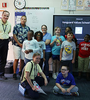  photo of students and staff smiling