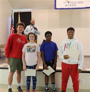 Vanguard staff and students smiling for a photo