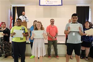 Vanguard middle school students smiling for a photo