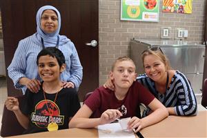 Vanguard students and staff smiling for a photo