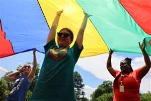 Vanguard staff and student participating in Field Day