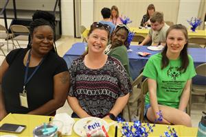 VTC staff and student smiling for a photo