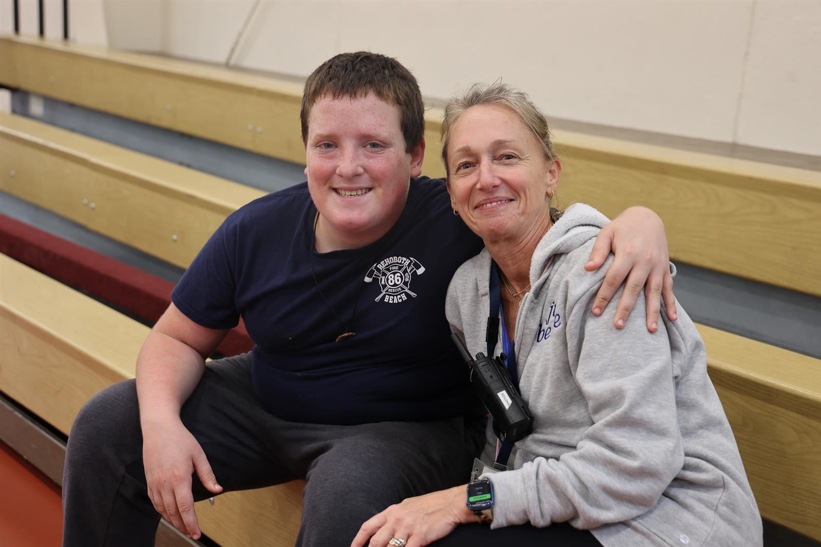 student and teacher posing