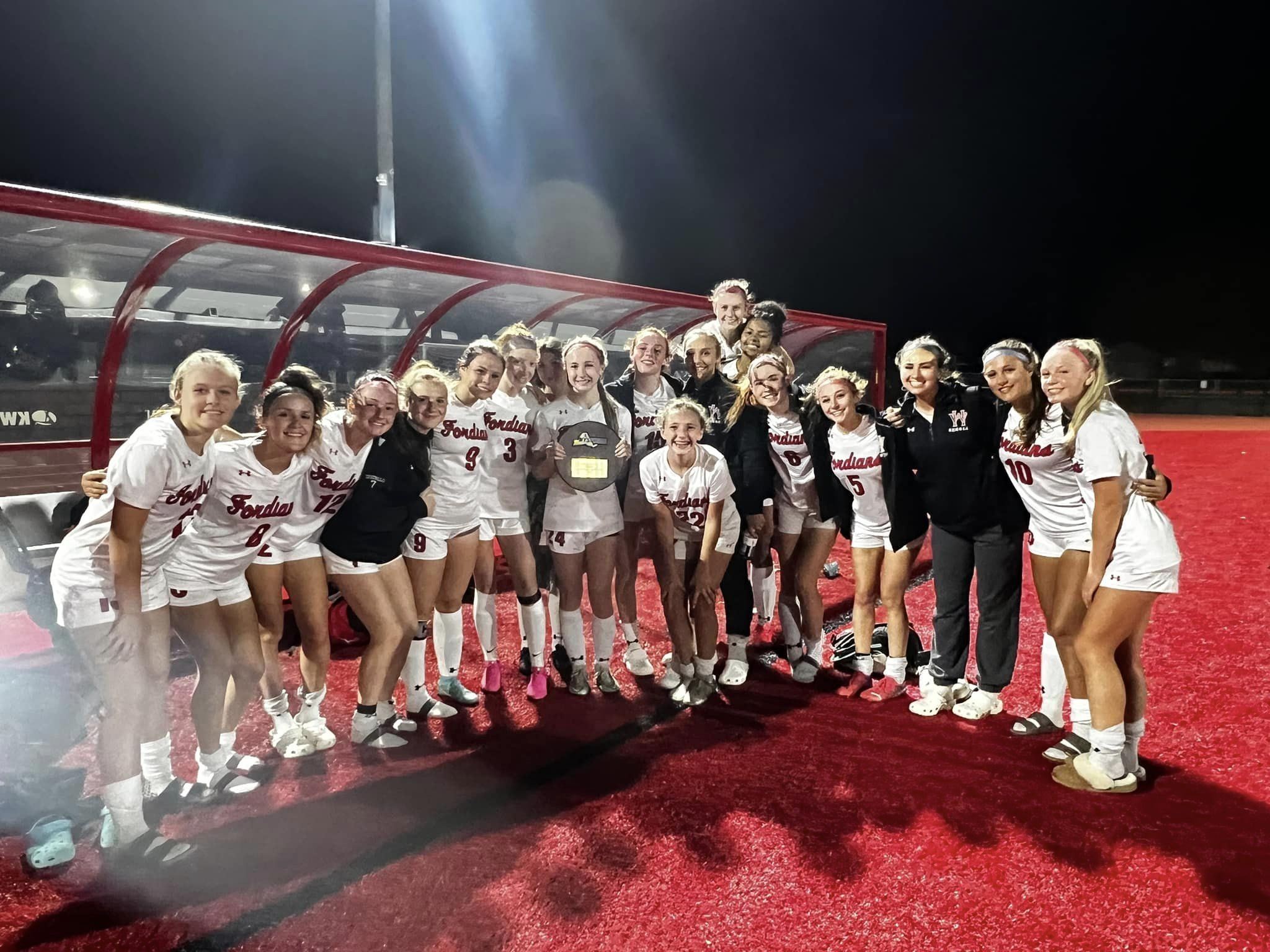 Girls soccer celebrate after a regional win