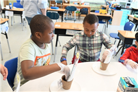 2 Elementary Students sitting at table thumbnail265920