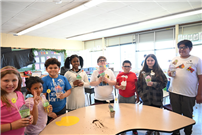 8 Students standing around table thumbnail265922