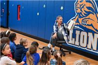 Staff member reads to students thumbnail264828