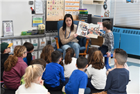 Staff member reads to students thumbnail264829