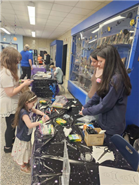 Students and parents in hallway for Night Under the Stars. thumbnail265947