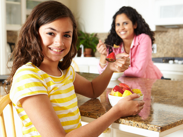 Youngster eating at home