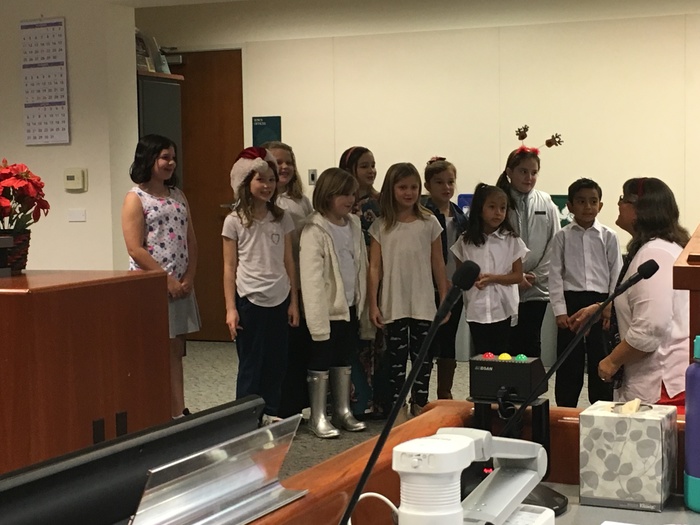 Windsor Creek Students bring holiday cheer to the Board Meeting