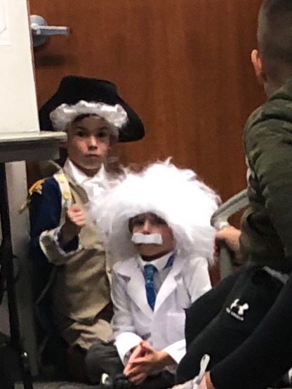 George Washington and Albert Einstein wait patiently to present to the School Board