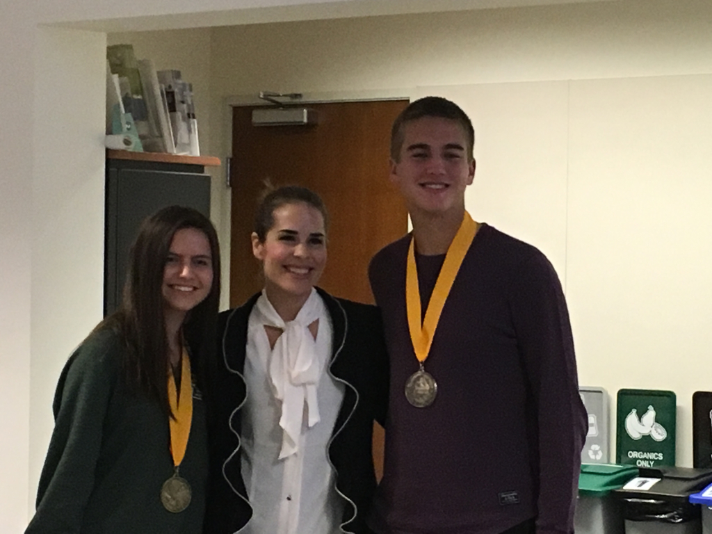 Samantha Moberly, Salutatorian & Jack Amorim, Valedictorian flank Board Member Stephanie Ahmad