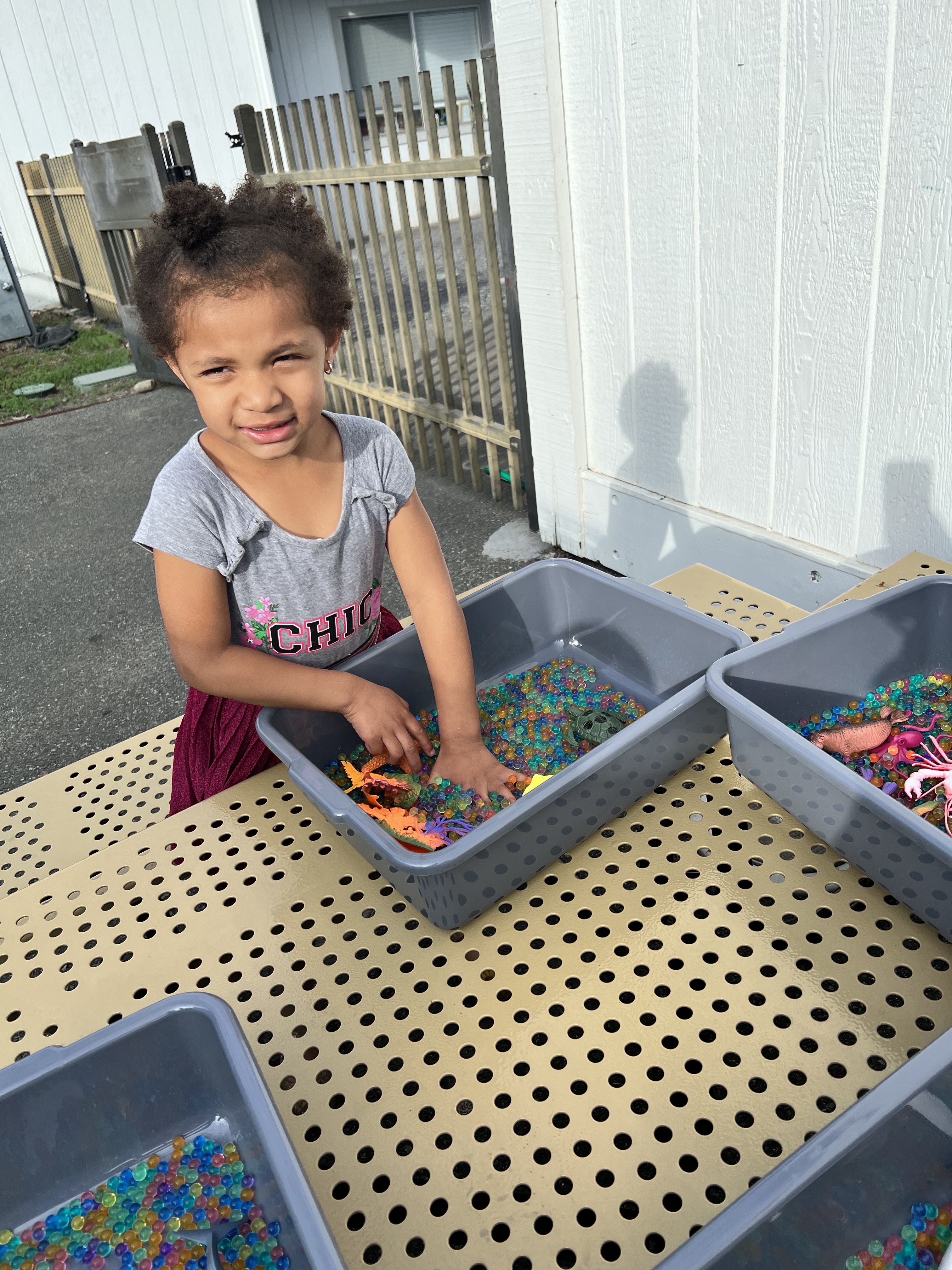 girl playing with orbeez