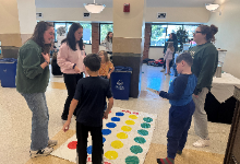 Five people playing twister