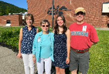 Hannah Wright standing with three people outside