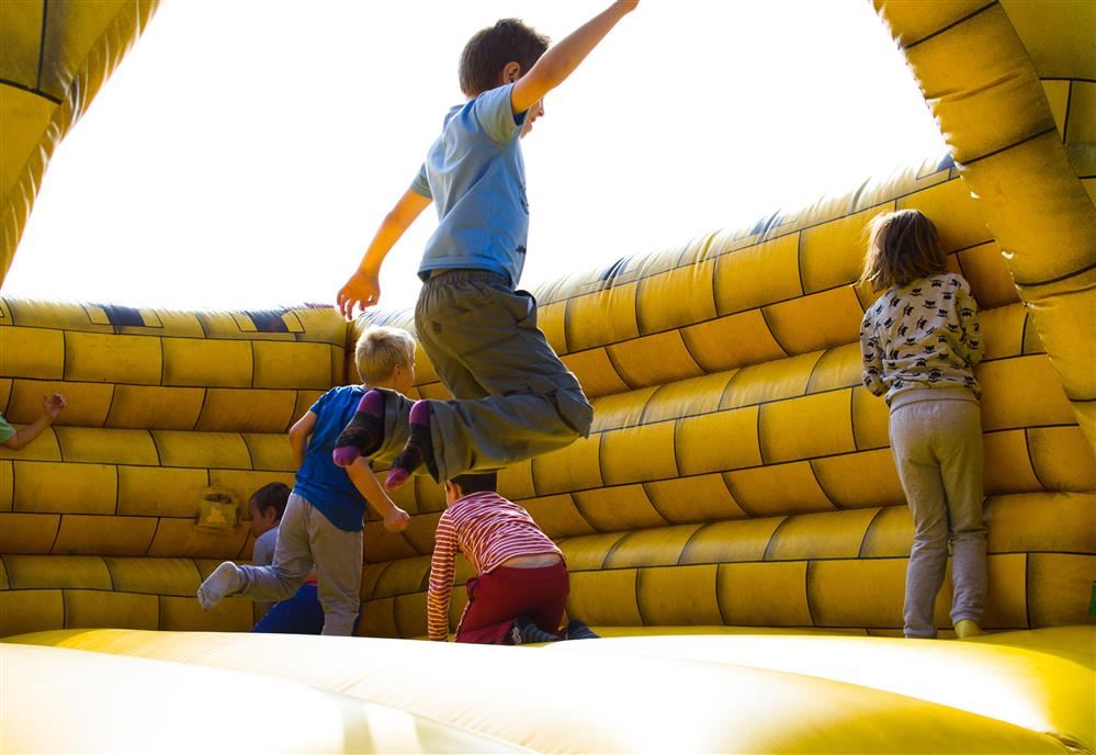 kid jumping in bounce house