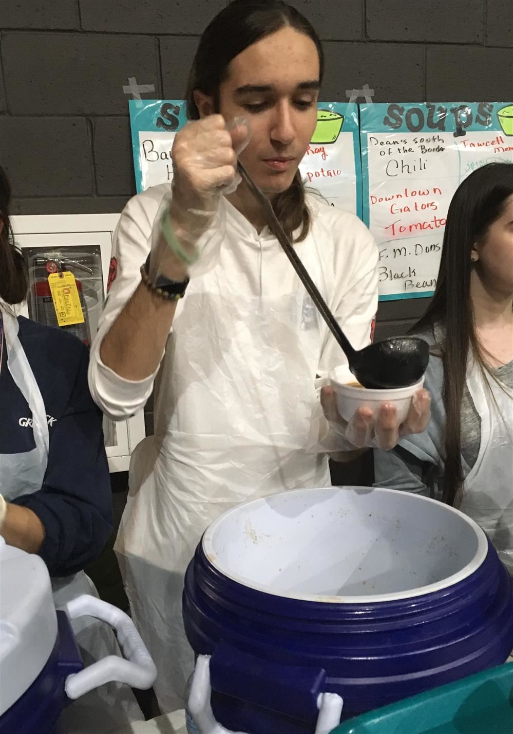 boy serving soup