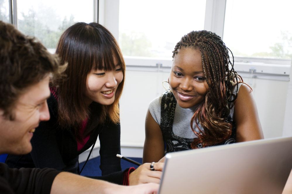 Students working at a computer.