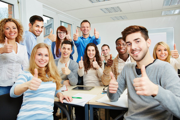 Students giving thumbs up.