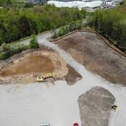 clearing in woods and a bulldozer