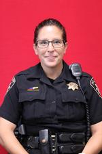 a woman wearing a police officer's uniform