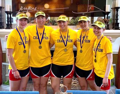 five girls wearing medals