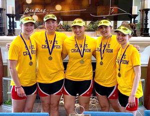 Four girls with gold medals