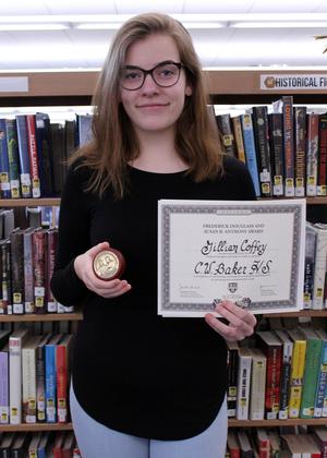 girl holding a medal