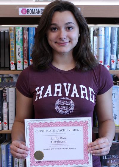 a girl holding a certificate