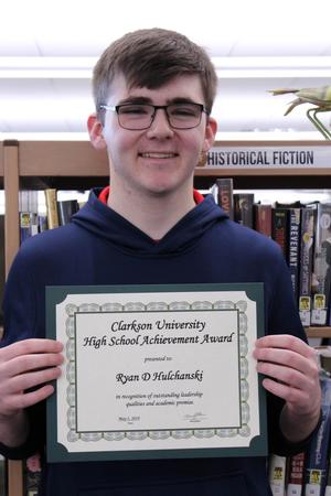 a boy hold a certificate